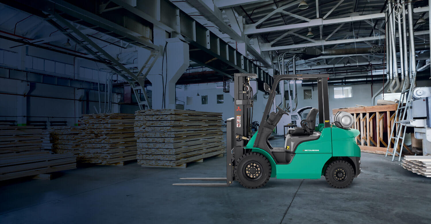 Mitsubishi IC pneumatic tire forklift in empty warehouse